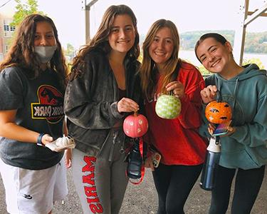 Image of the Red Ink club with painted pumpkins.